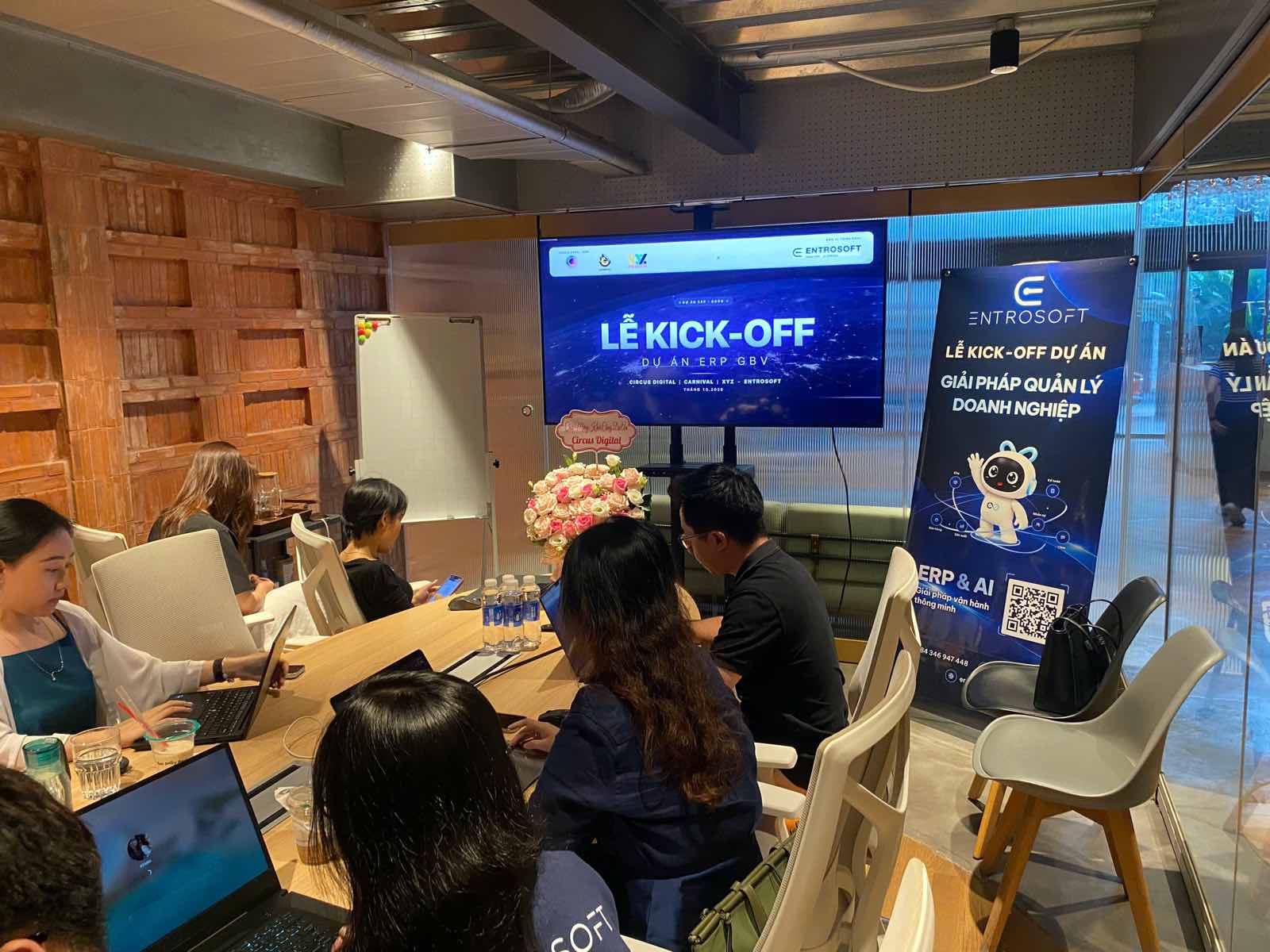 The ENTROSOFT and GBV Holding teams around the meeting table, with the GBV ERP project kick-off on screen